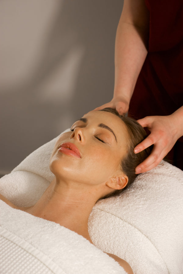 A professional receiving an express massage at a Melbourne CBD spa, designed to relieve tension and stress during a quick lunch break.