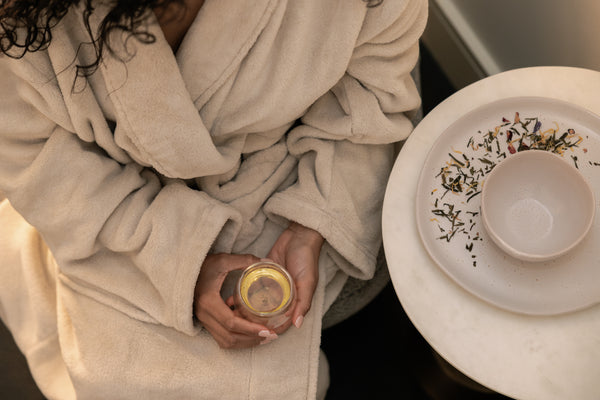 Guest enjoying a calming moment with tea before a spa treatment at Botanica Wellness Spa in Melbourne CBD.